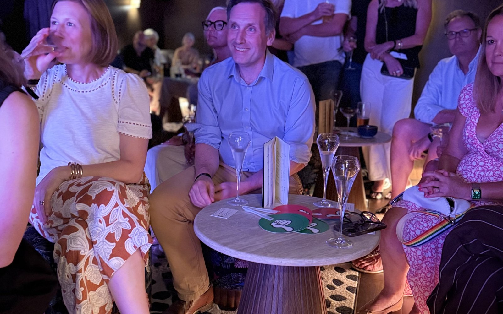 A packed audience at Markets and Martinis, cocktails in hand